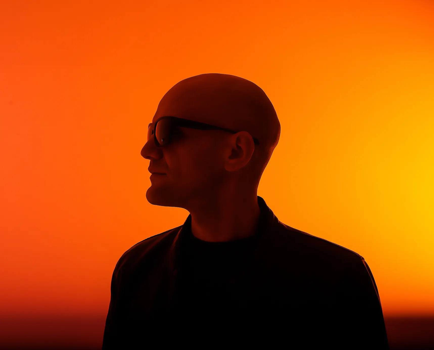 GANGSTANTIN against an orange-lit background